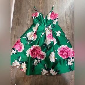 Green boutique dress with flower detail